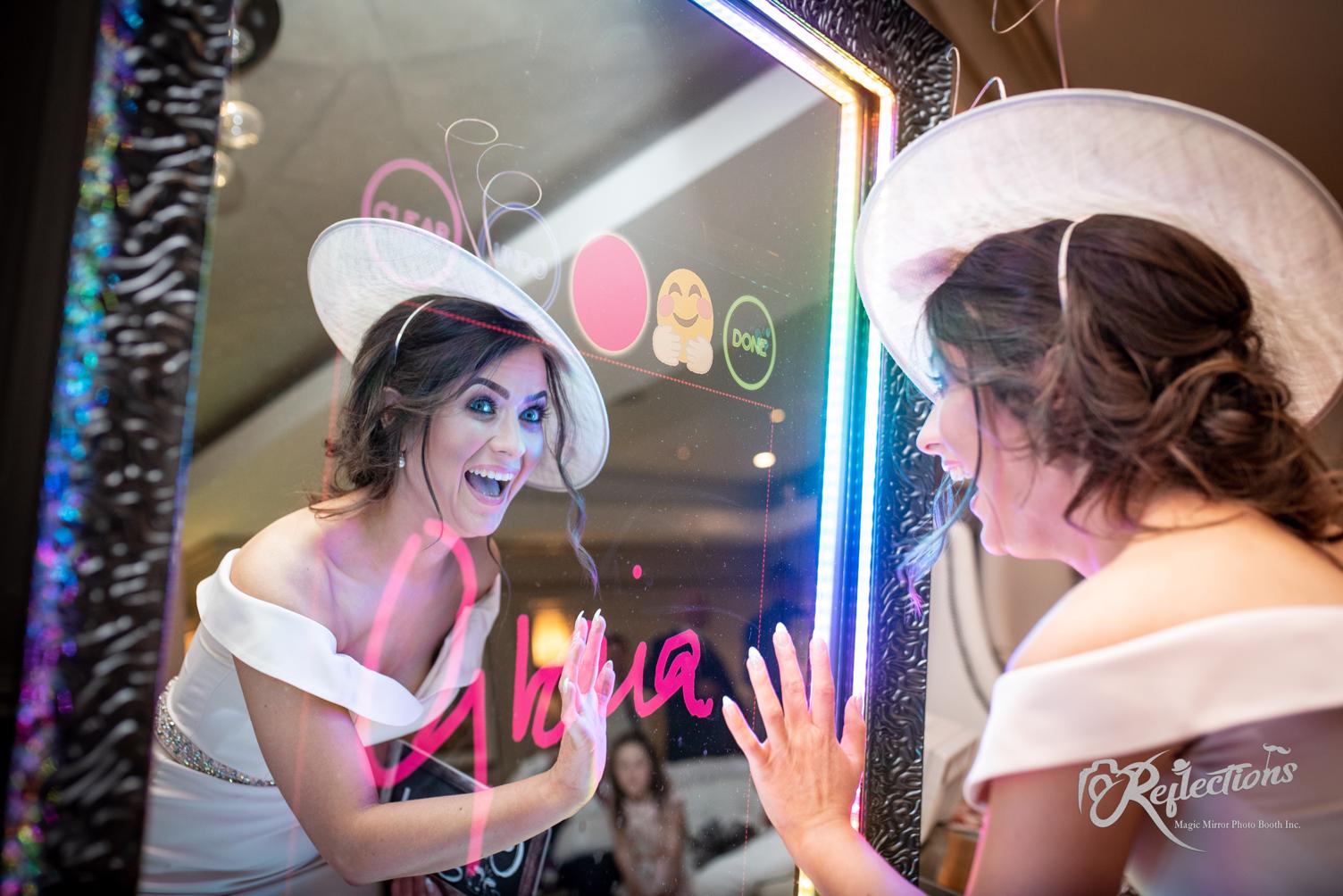 bride with hat signing image.jpg
